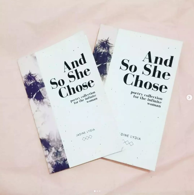 A paperback and hardback copy of 'And So She Chose' size comparison