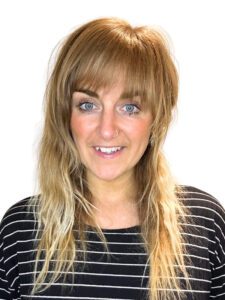 A front profile shot of Jadine Lydia smiling,