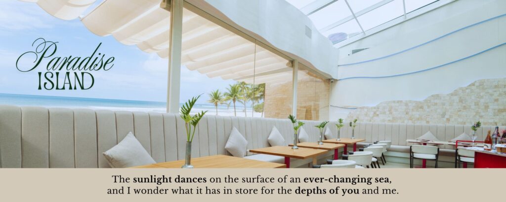 The interior of a luxury fish restaurant called 'Paradise Island' with a sea view and a banner featuring a poem that reads 'The sunlight dances on the surface of an ever-changing sea, and I wonder what it has in store for the depths of you and me..'